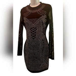 Black gold studded body con dress. May fit large. Small snag on back of dress